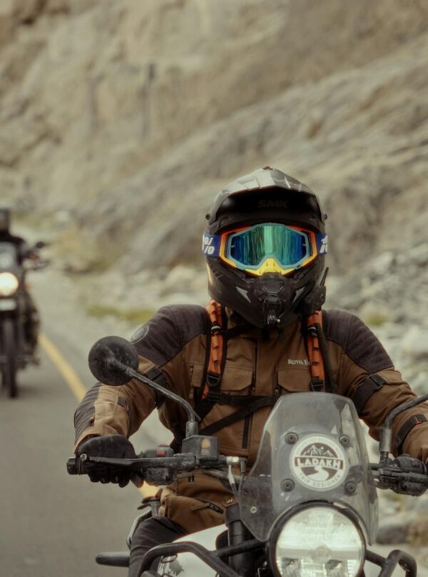 Motorcyclists on Ladakh bike tour crossing rugged Himalayan landscapes