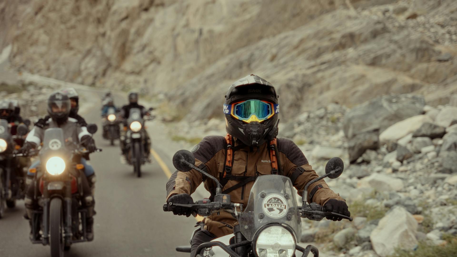 Motorcyclists on Ladakh bike tour crossing rugged Himalayan landscapes