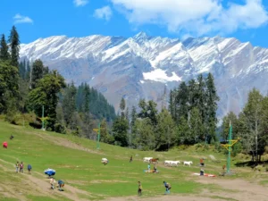 Scenic view of Solang Valley near Manali with green mountains, clear skies, and adventure activities